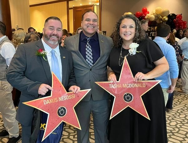 ISD Superintendent Ken Gregorski, center, celebrates with Daxus Nesossi and Tasha McDonald, who were recognized at the Aug. 4 Region 4 Teachers of the Year ceremony. The annual Teachers of the Year program honors teachers who exemplify best practices in student instruction and innovative classroom environments throughout the region.